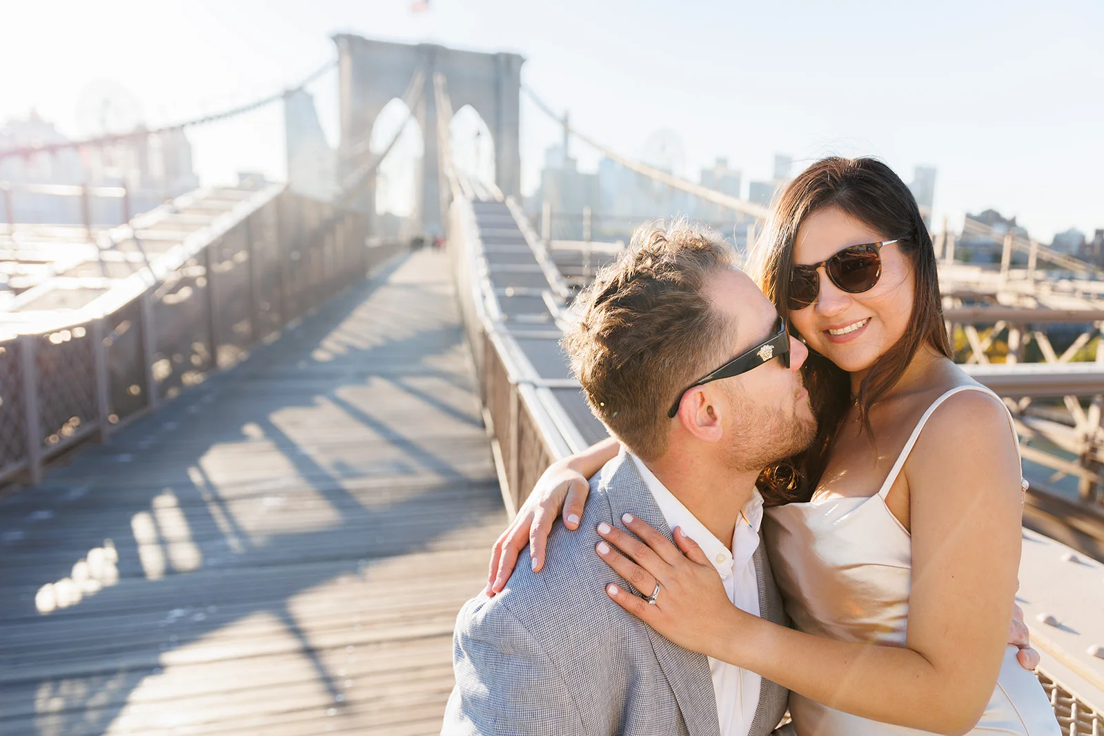 A couple during their engagement photoshoot at Brooklyn Bridge in New York City